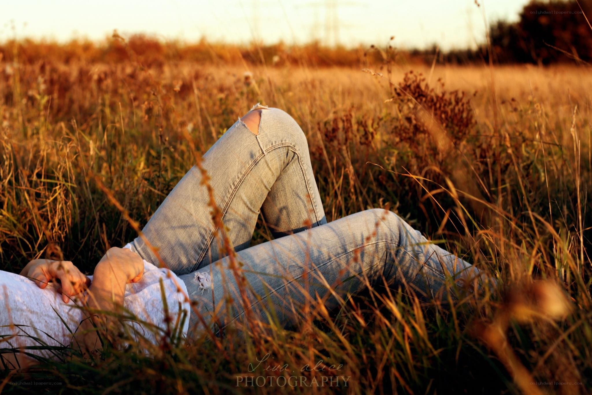 person lying in a field