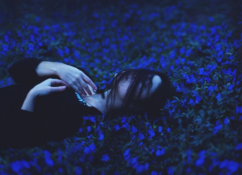 Person Lying in Flowers — Blue