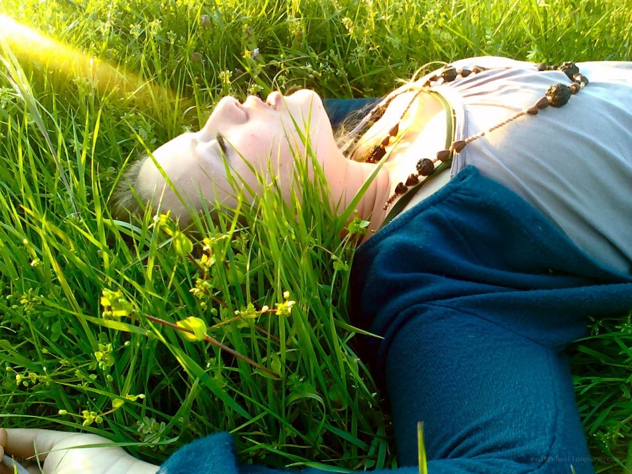 person lying in grass