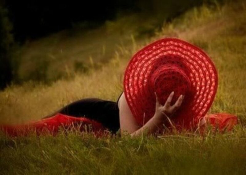 Person Lying in Grass — Red