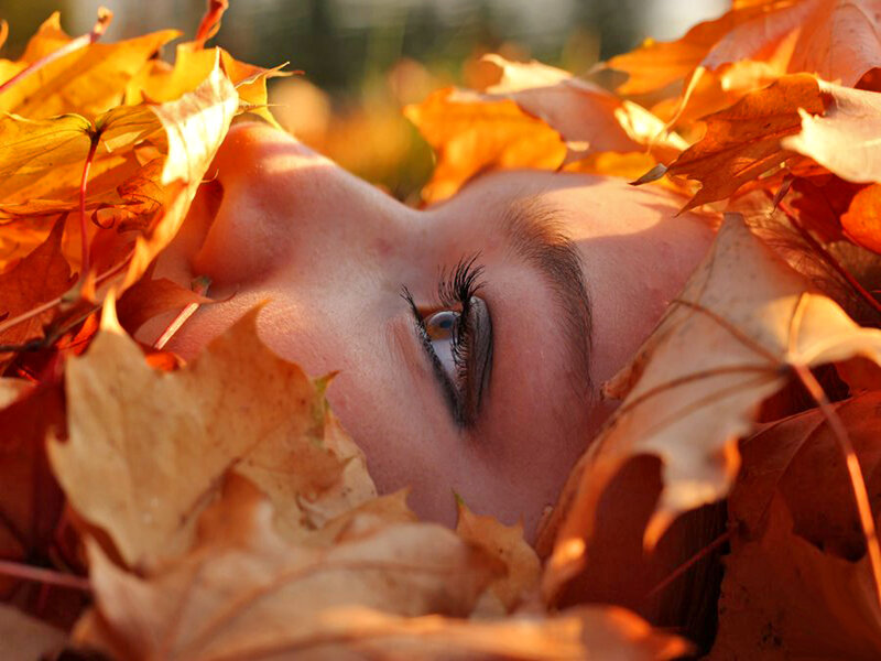 Person Lying in Leaves — Orange