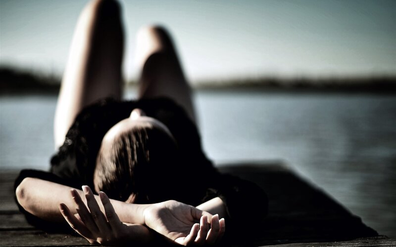 person lying on a dock