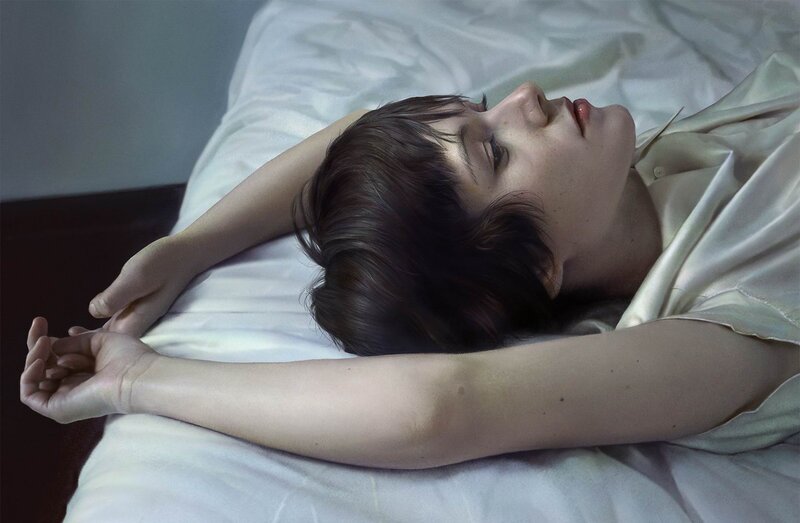 person lying on bed in white shirt