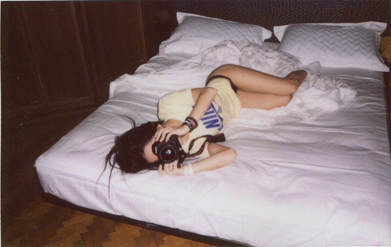 Person Lying on Bed — White, Relaxed, Photograph, Camera
