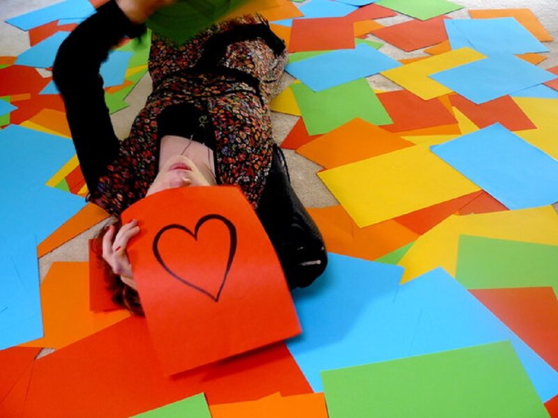Person Lying on Colored Paper