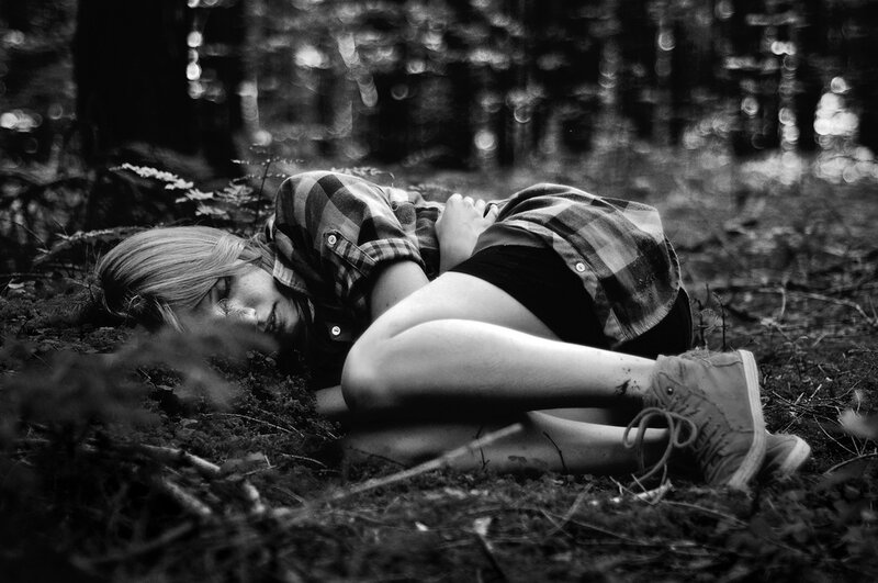 Person Lying on Forest Floor
