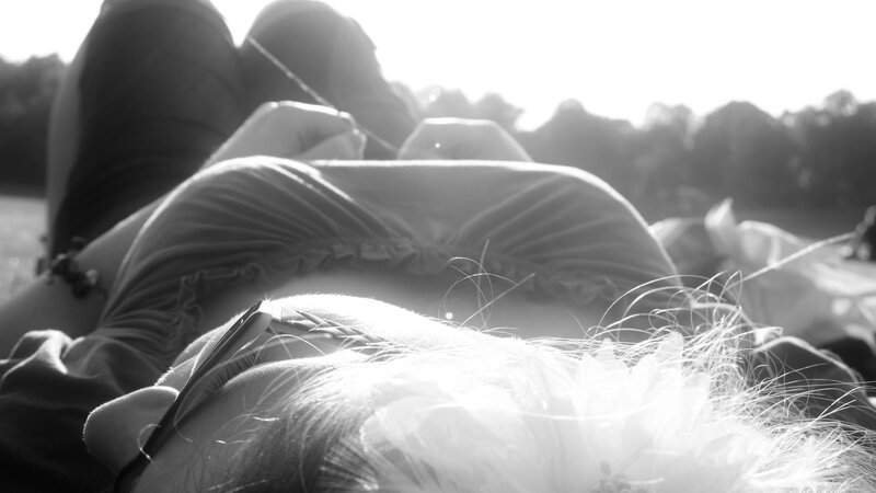 Person Lying on Grass — Black, Serene