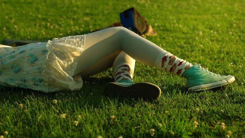 Person Lying on Grass — Green