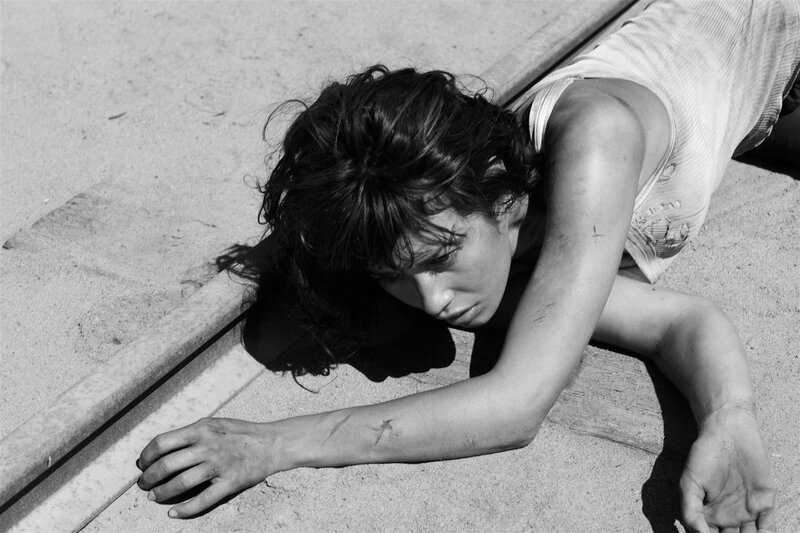 person lying on ground in distress