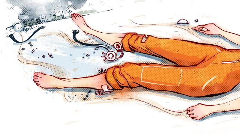 person lying on ground with medical equipment