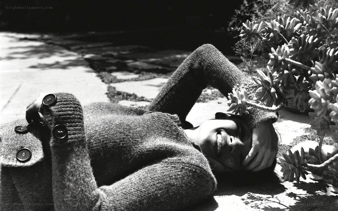 Person lying on ground with succulent