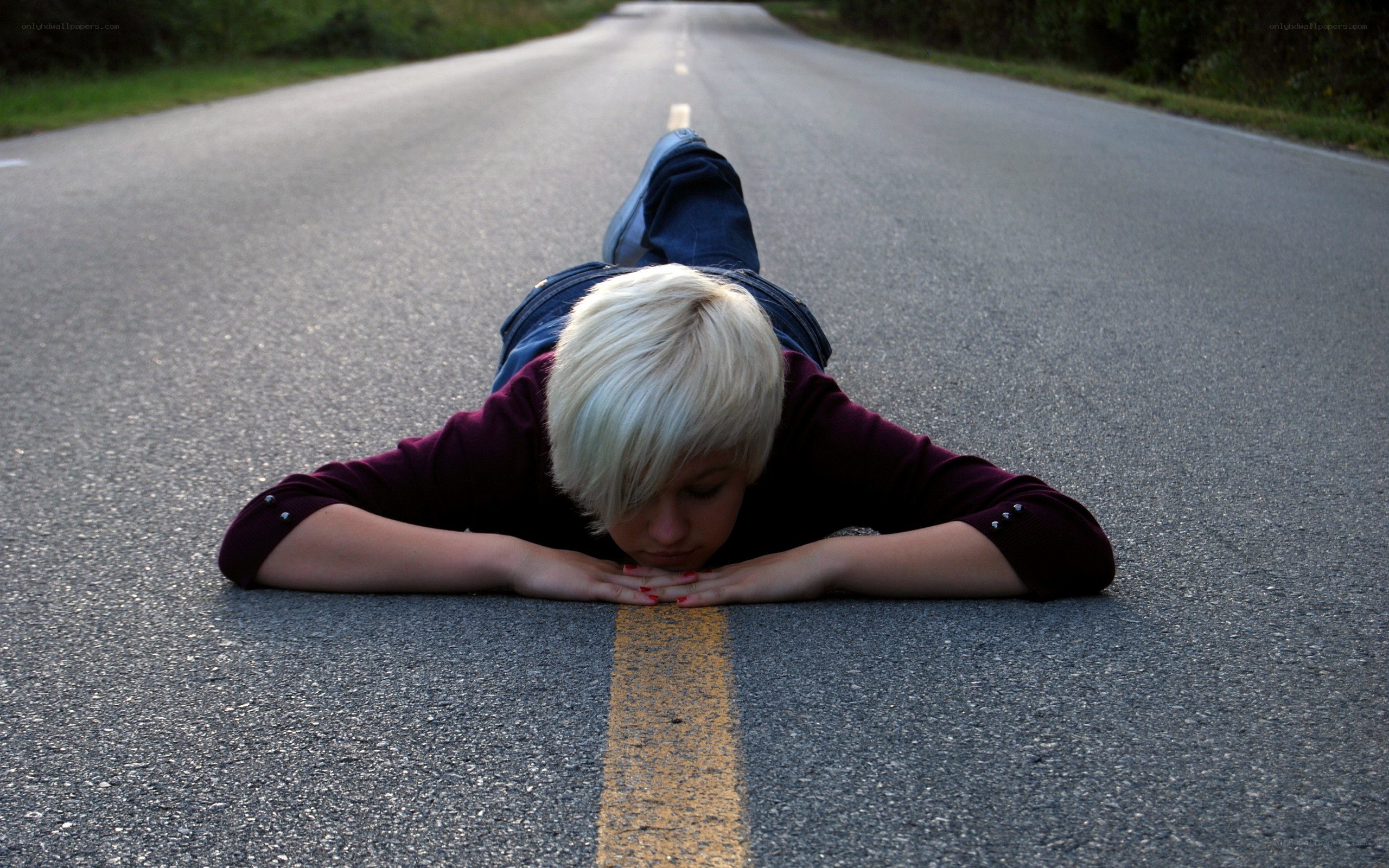person lying on road