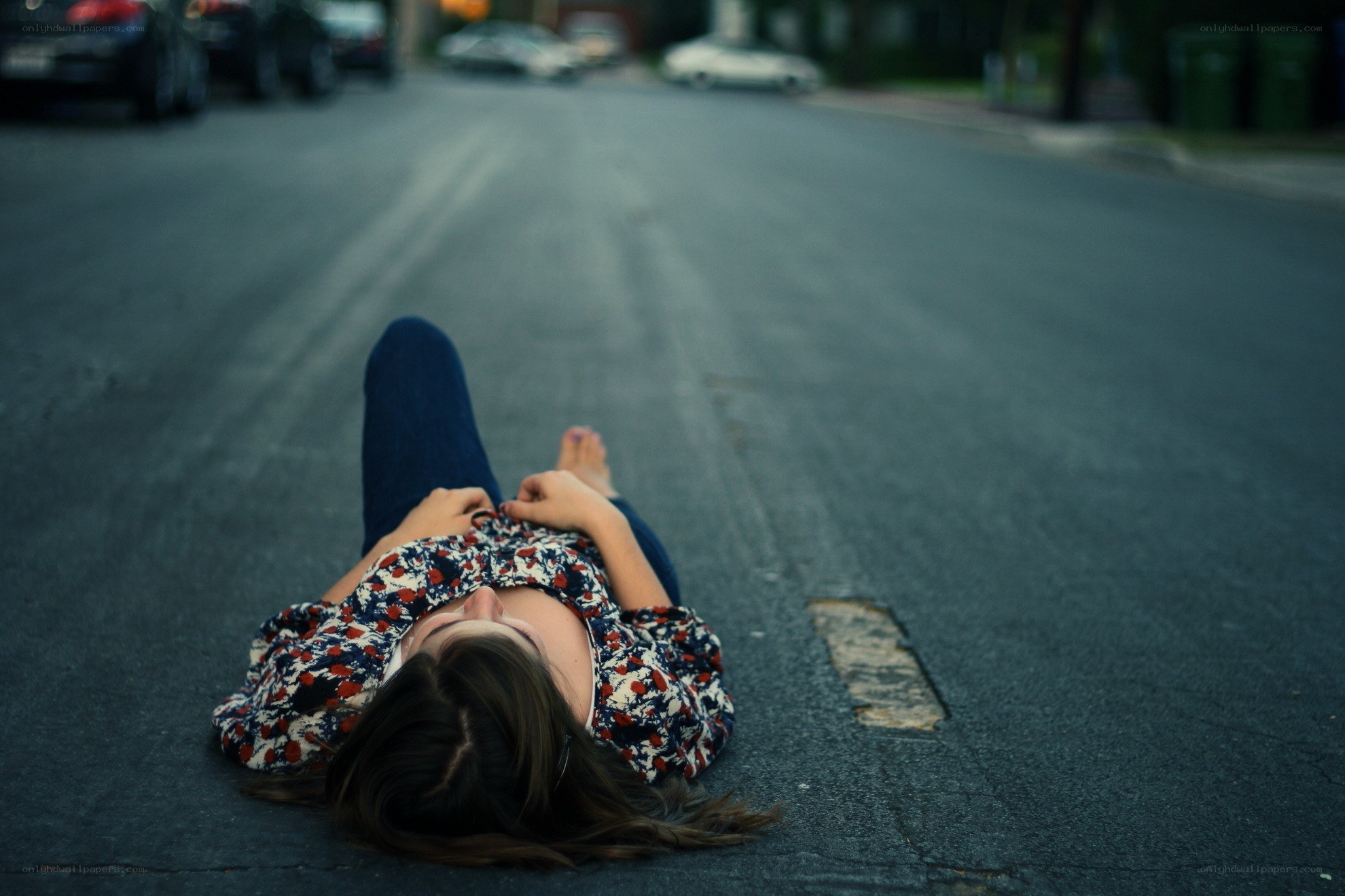 person lying on street