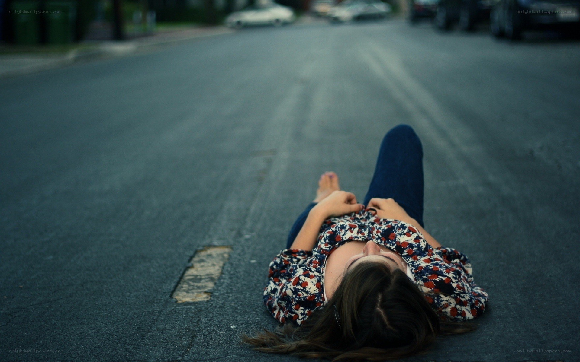 person lying on street