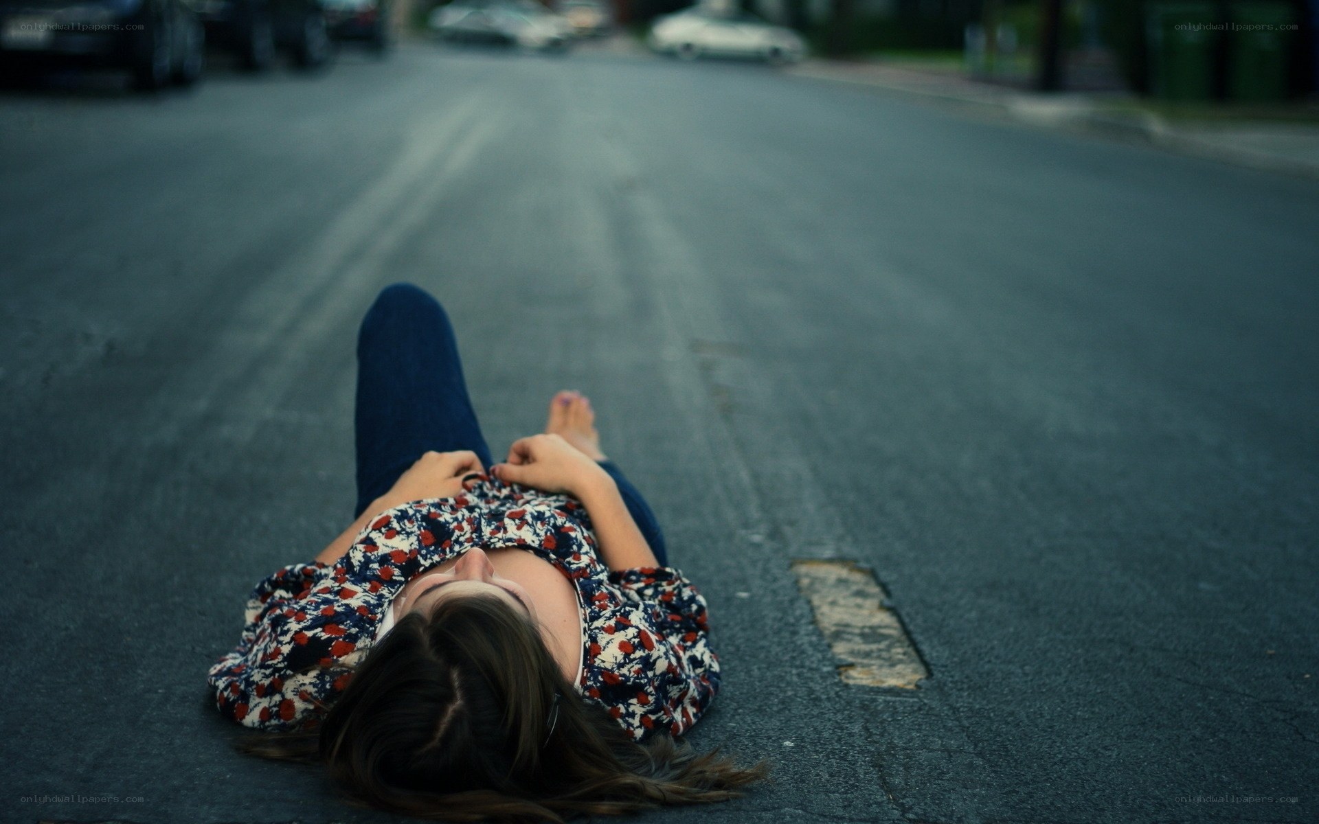 person lying on street