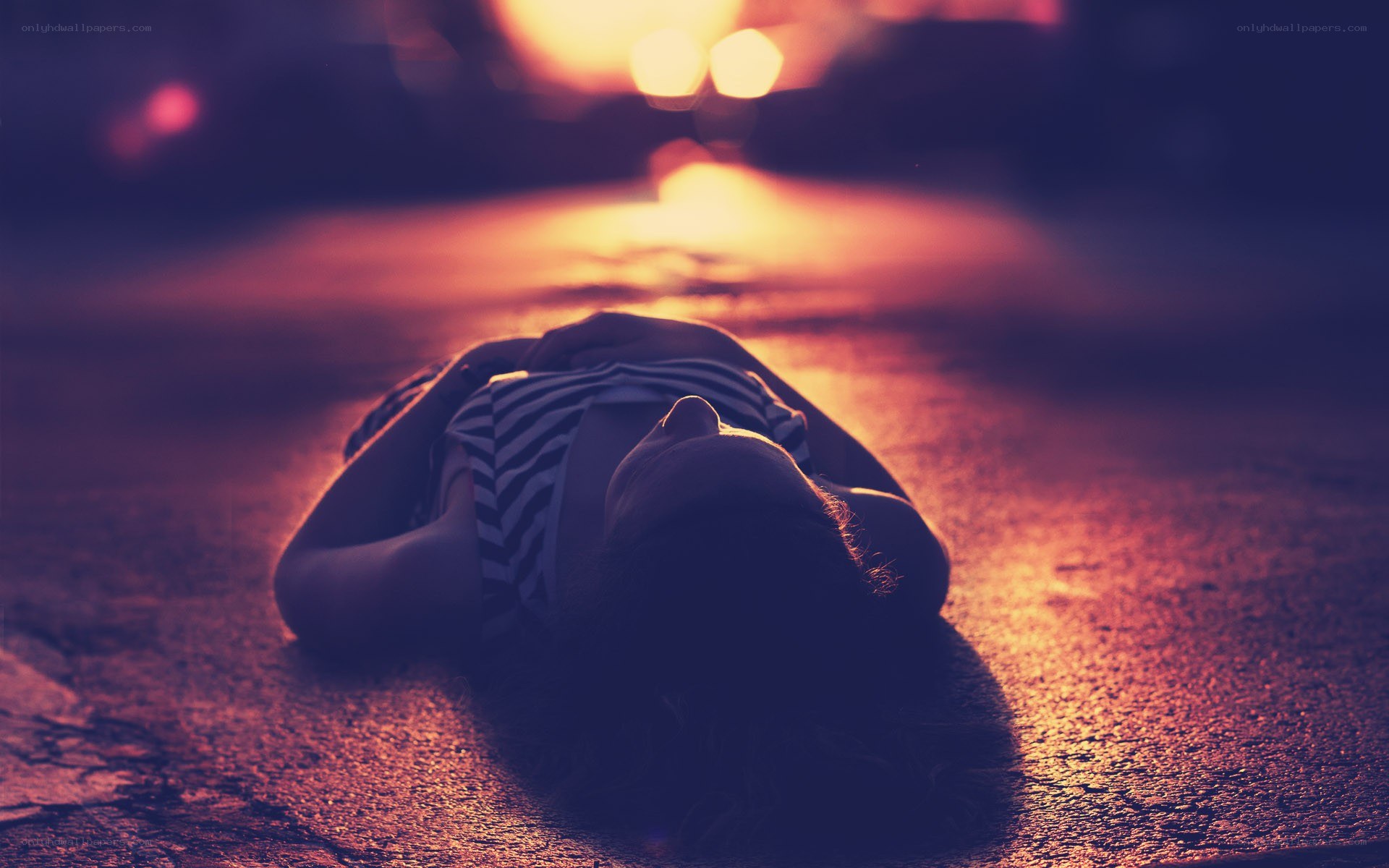 person lying on the ground at night
