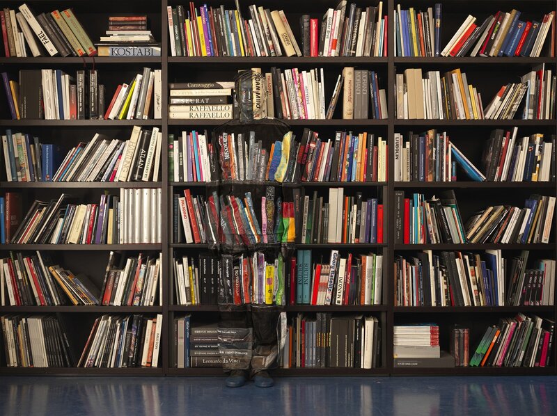 person made of books in library