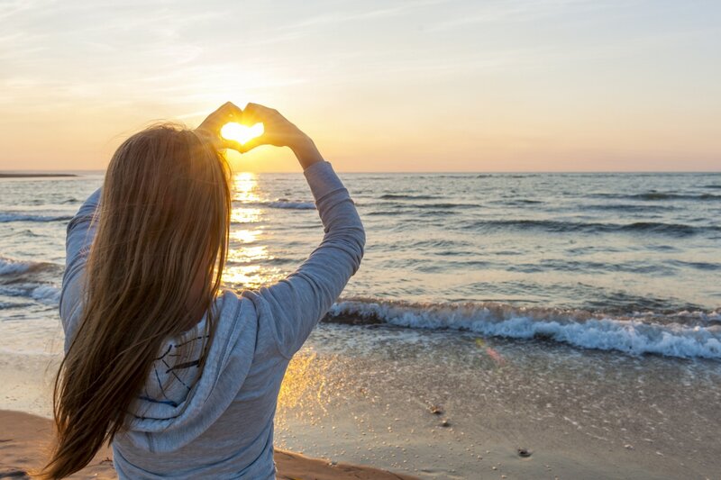 Person Making Heart Shape — Gold