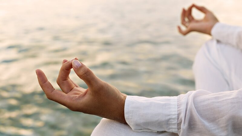 Person Meditating by Water — White