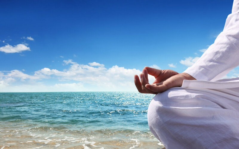 Person Meditating on Beach — Blue