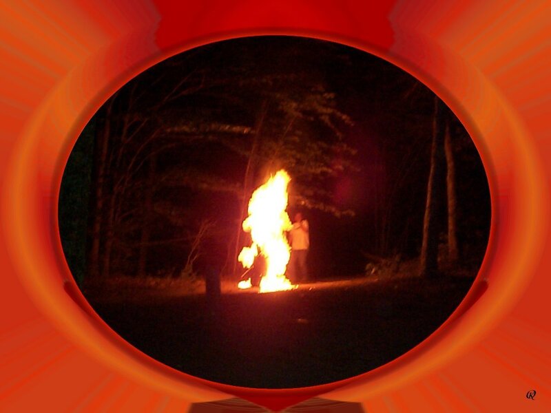 Person near a bonfire at night
