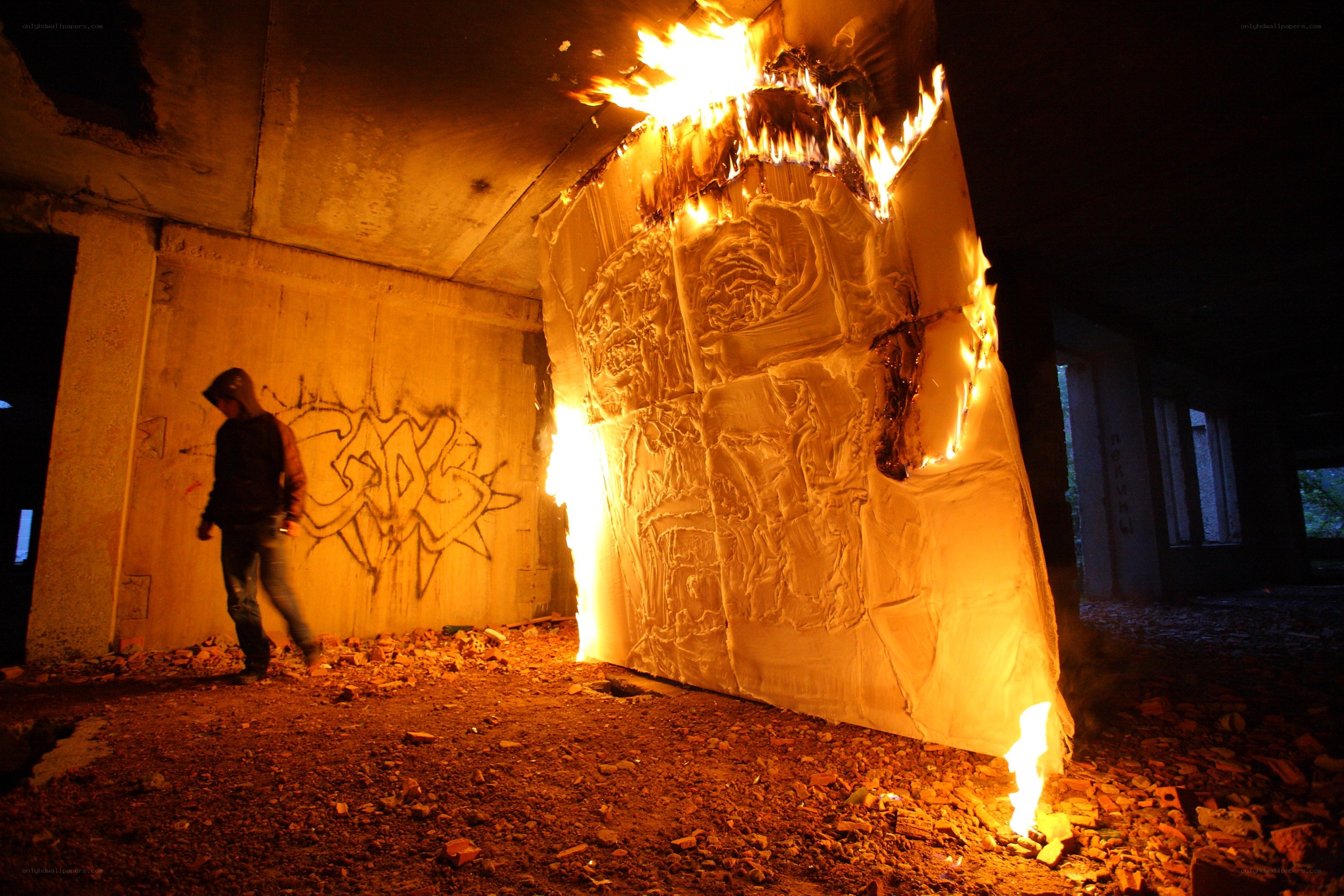 Person near burning structure