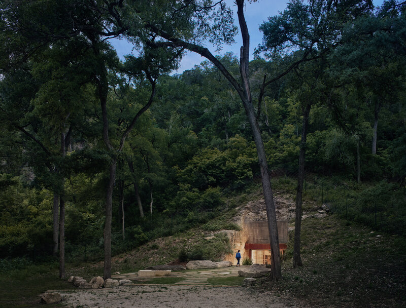 Person Near Cave House