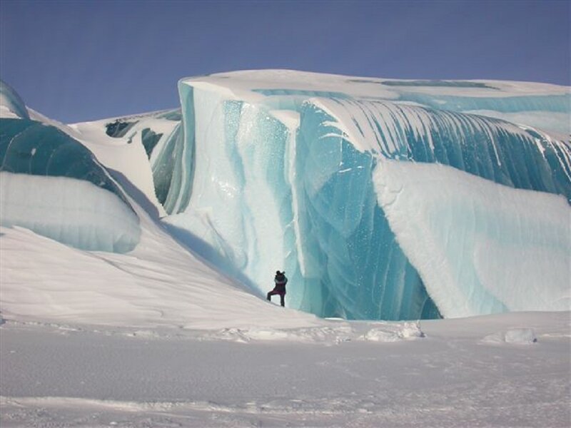 Person Near Ice Formation — White