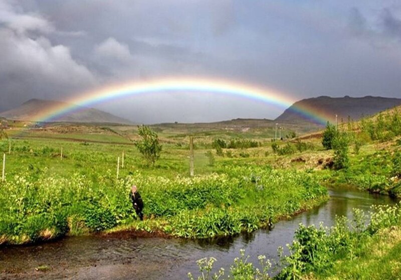 Person Near River under Rainbow