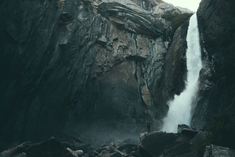 Person Near Waterfall — Gray