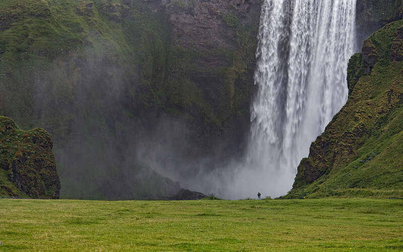 Person Near Waterfall — Green, Dramatic, Photograph