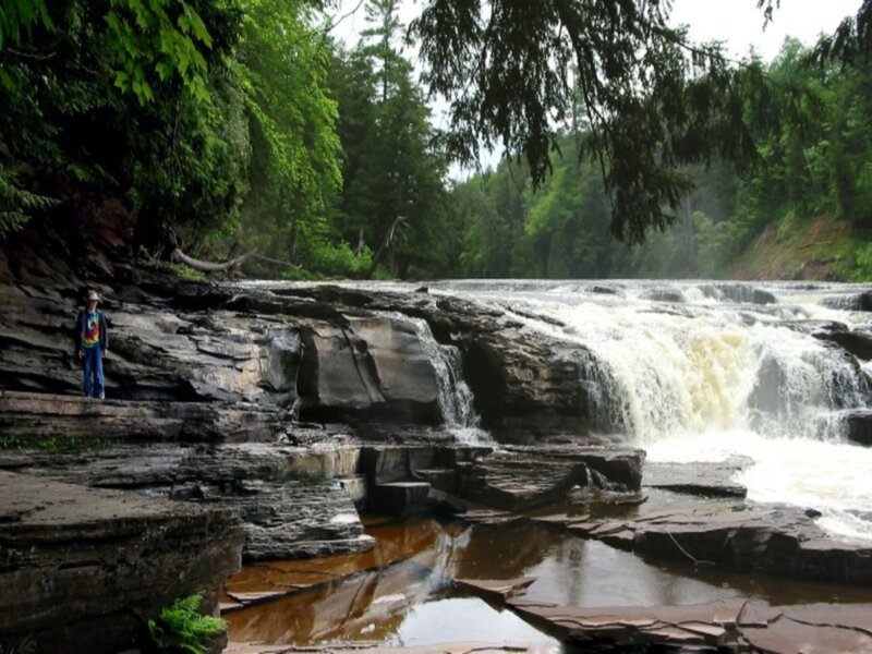 Person Near Waterfall — Green, Natural