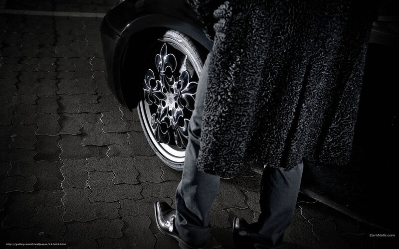 person next to car wheel