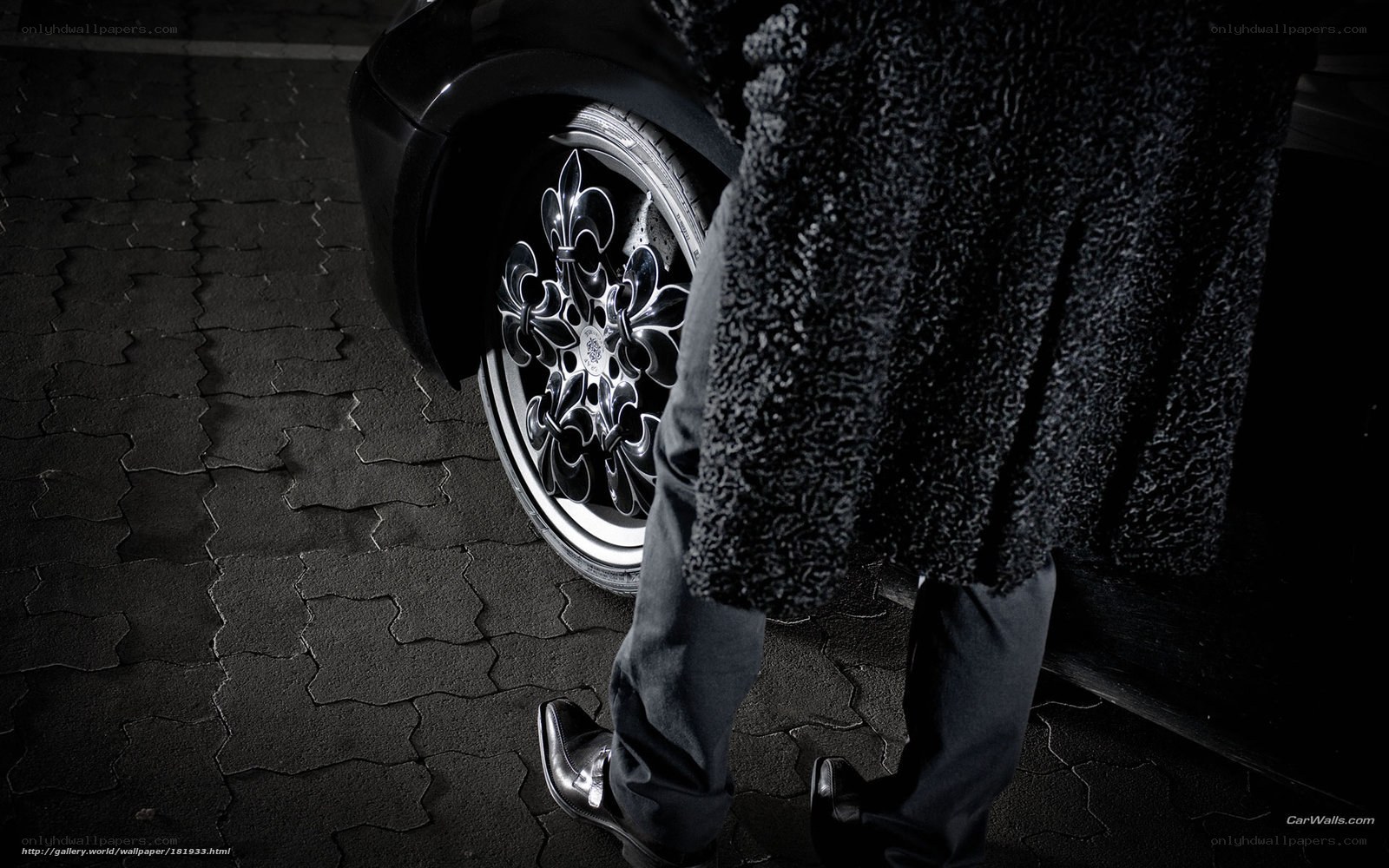 person next to car wheel