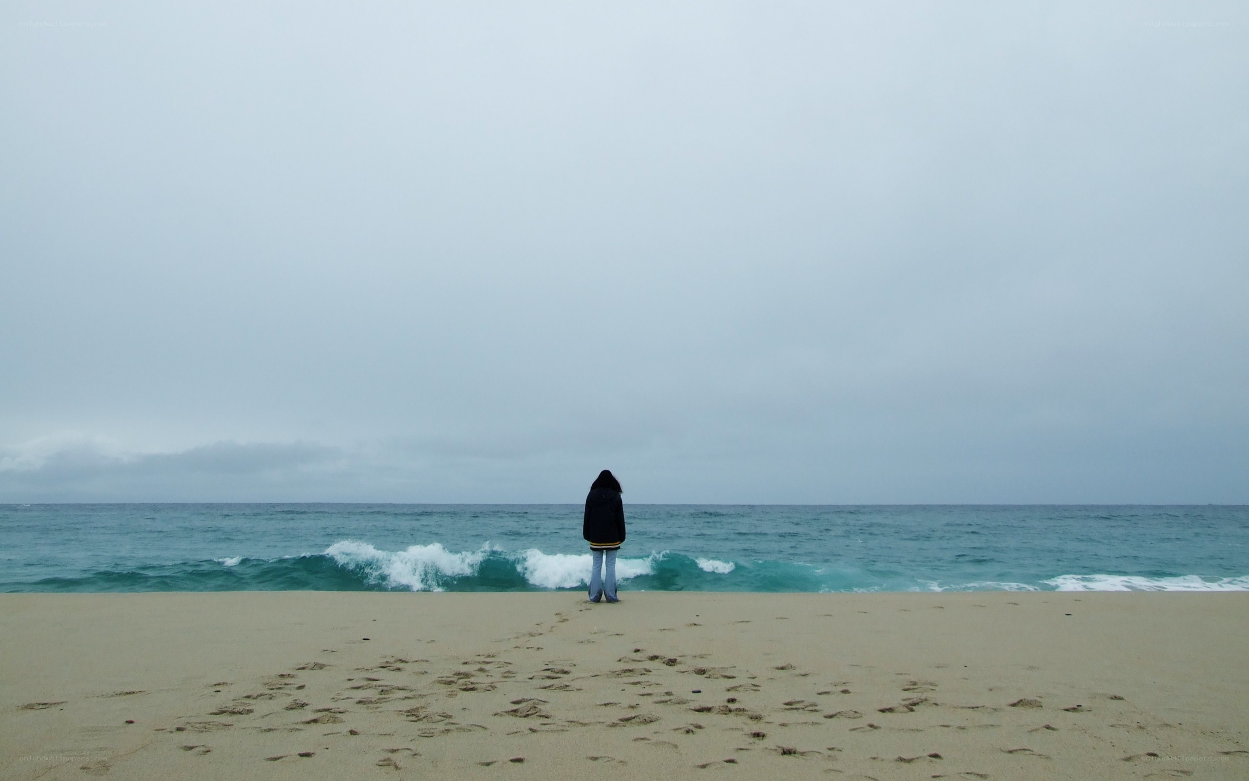 Person on a beach at dusk