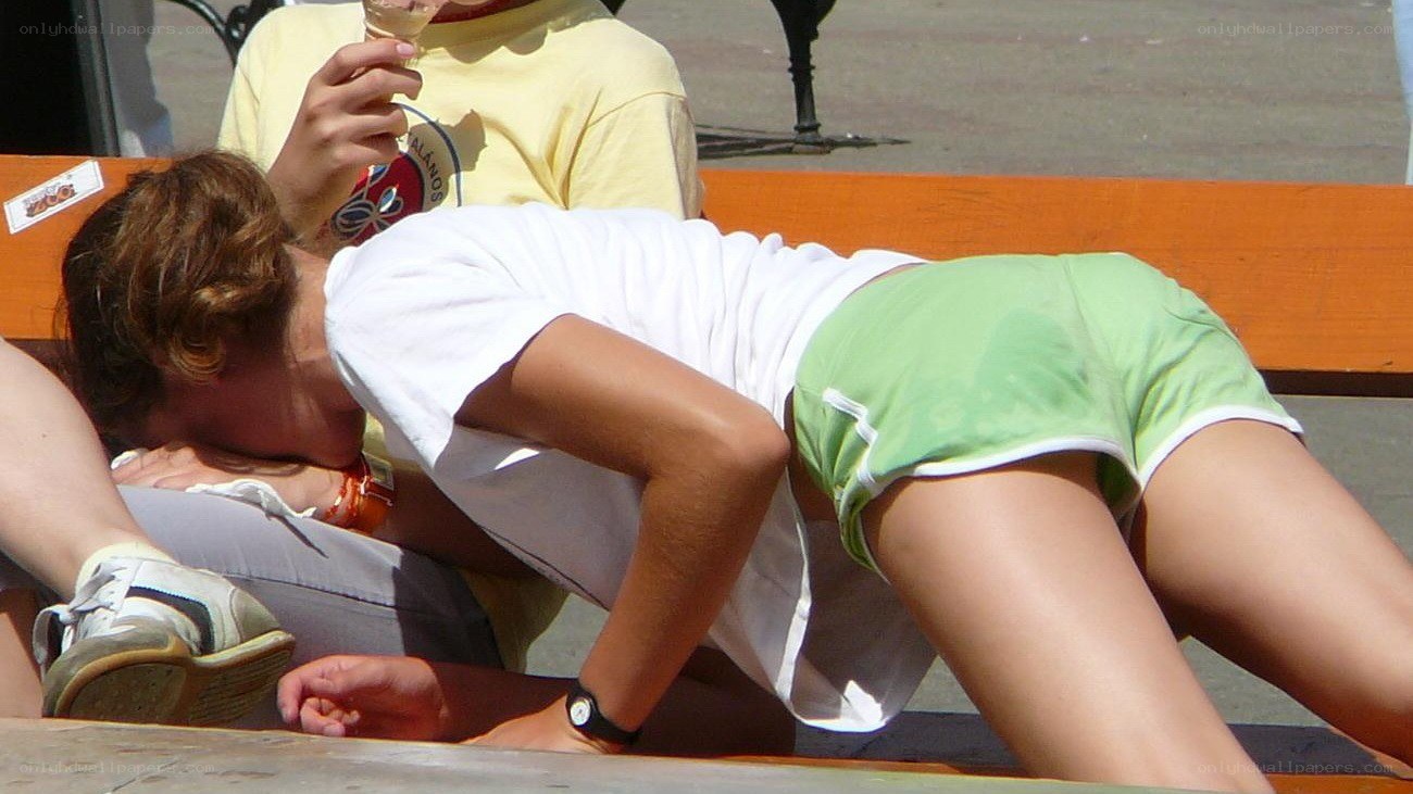 Person on a bench in summer