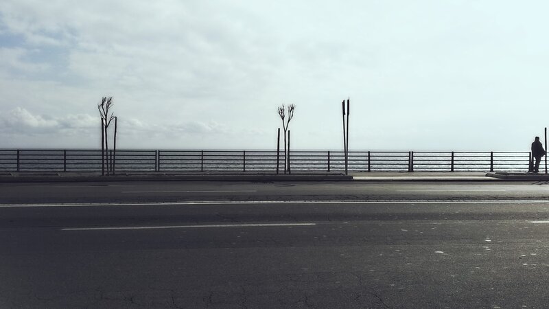 person on a coastal road