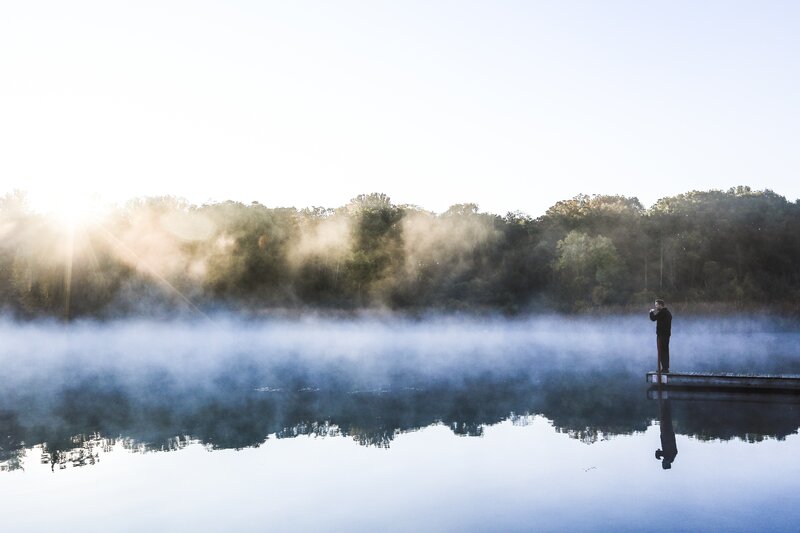 Person on a Dock — Blue, Serene, Morning