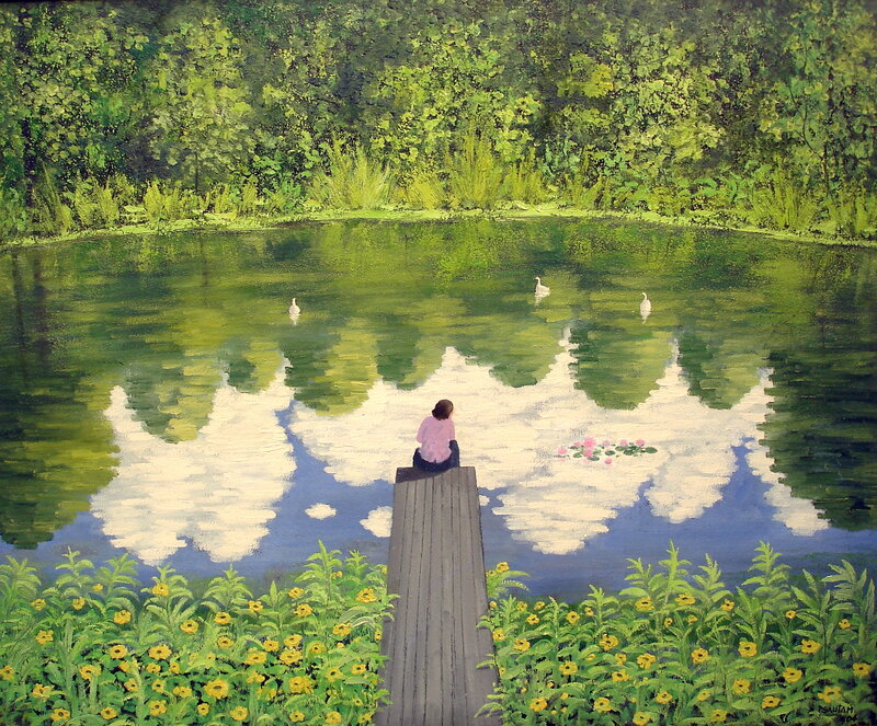 Person on a dock by a pond