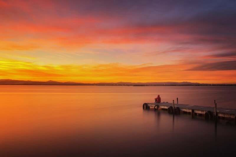 Person on a Dock — Orange