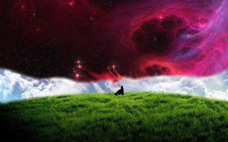 Person on a grassy hill under nebula