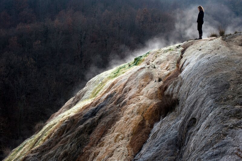 Person on a mineral cliff