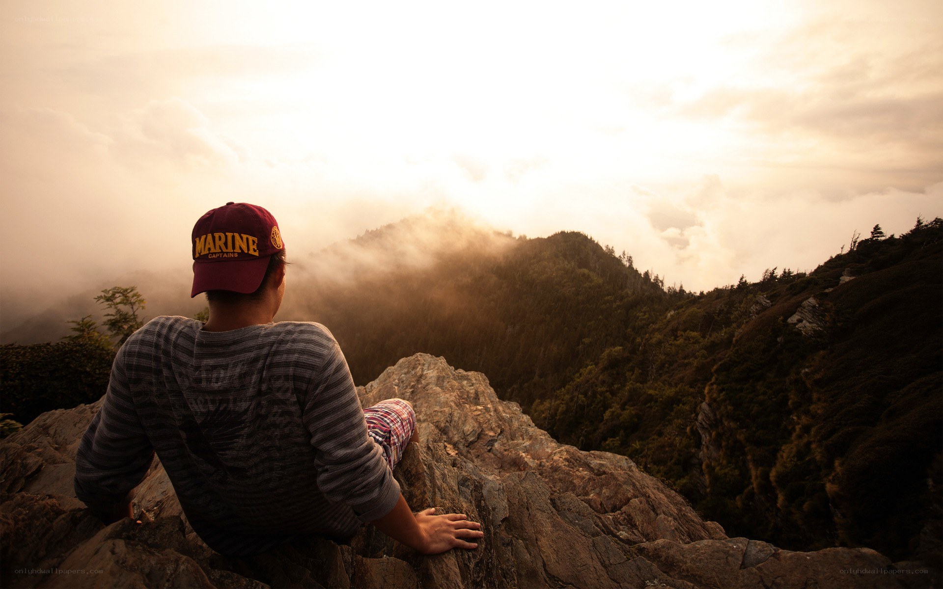 Person on a mountain at sunrise