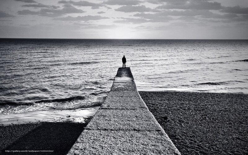 Person on a pier at the sea