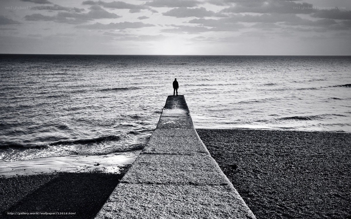 Person on a pier at the sea