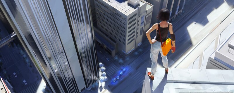 person on a rooftop overlooking city