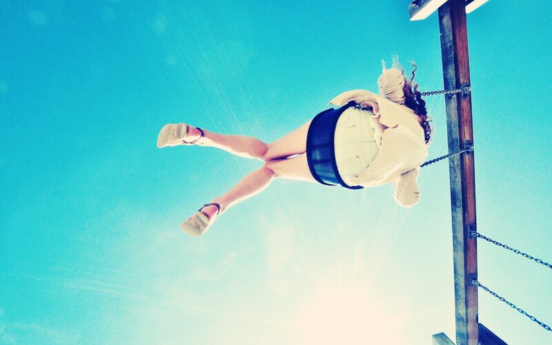 Person on a swing against the sky