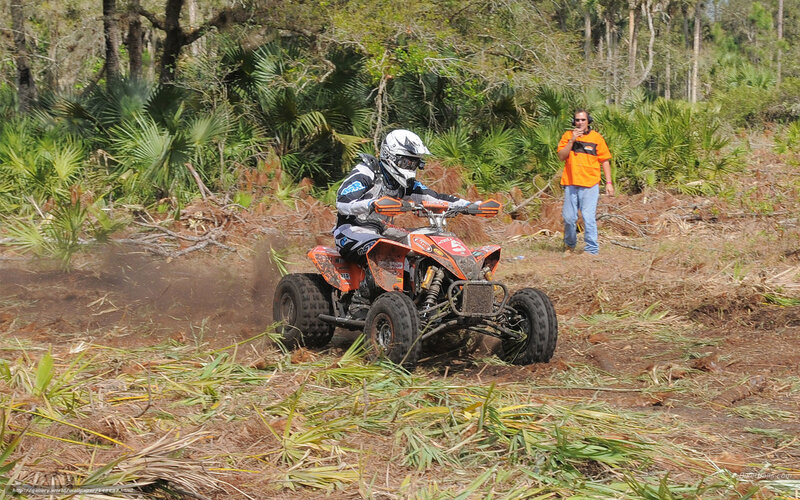 Person on ATV in Forest — Orange, Active