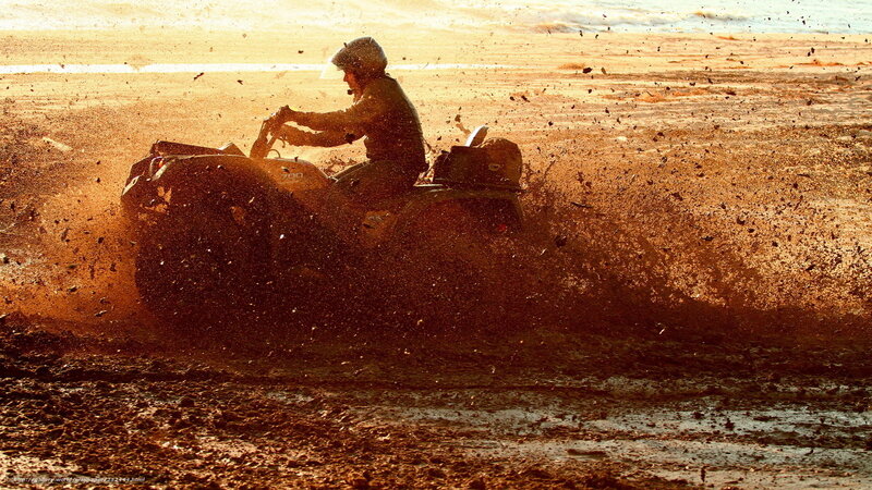 Person on ATV in Mud — Brown