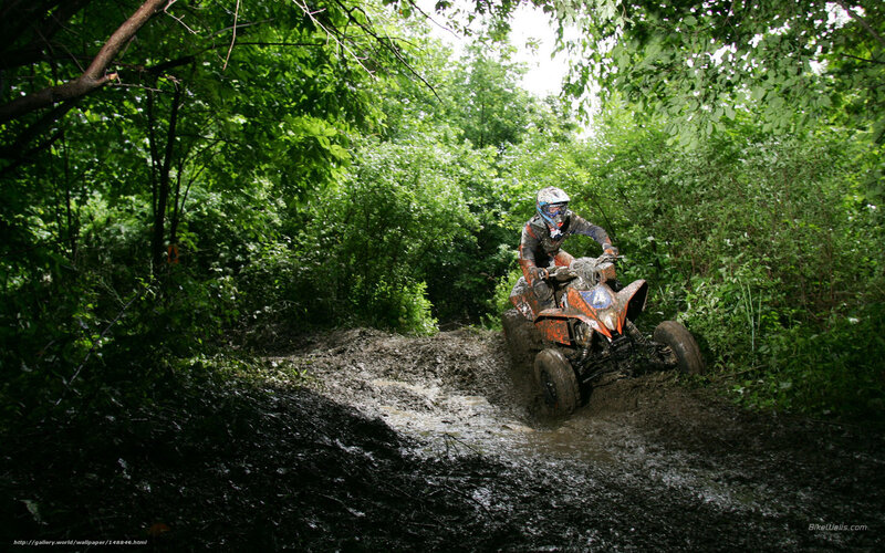 Person on ATV in Mud — Green